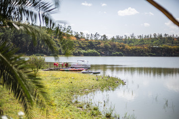 Small boat docked on quiet, serene lake in Ethiopia, Africa.