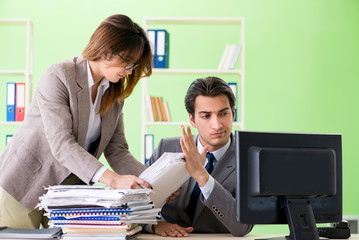 Man employee suffering from excessive work 