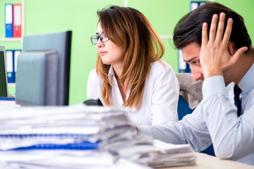 Two financial specialists working in the office