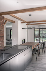 Stylish interior in modern style with wooden beams
