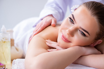 Fototapeta na wymiar Woman during massage session in spa