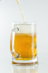 Glass of beer on white background.