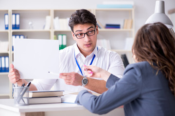 Sales assistant discussing transaction with customer