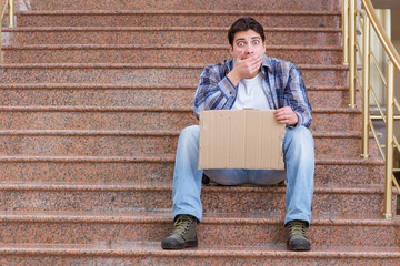 Young man begging money on the street