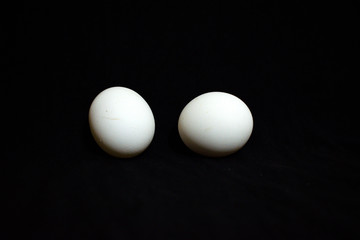 Two Eggs in black background