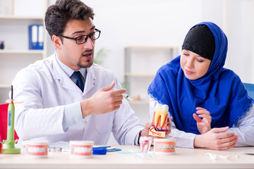 Dentist doctor and assistant working on new tooth implant