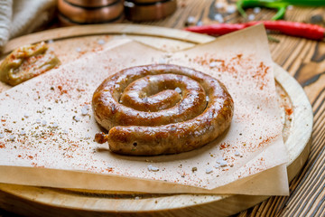 fried snail sausages on the Board