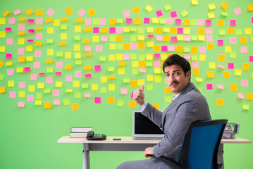 Businessman with many conflicting priorities   