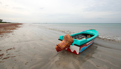 Sport fishing boat on tropical beach Nilaveli beach in Sri Lanka Asia
