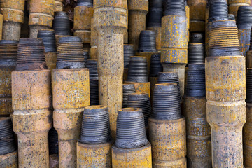 Drilling of oil and gas wells. Drill pipe inspection. Tubing for oil and gas listed on the pedestal out of the wells after washing and ready for inspection. Stack of casing laying on the deck