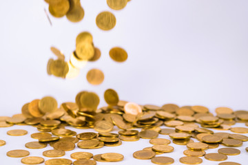 Movement of falling gold coin, flying coin, rain money with soft shadow on white background, business and financial wealth and take profit concept.