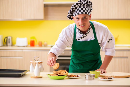 Young Man Cook Preparing Cake In Kitchen At Home 