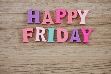 Fototapeta premium happy friday alphabet letter with space copy on wooden background