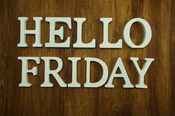 hello friday alphabet letters on wooden background