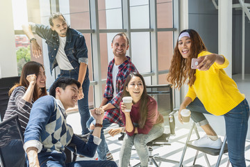 Group Of Asian and Multiethnic Business people with casual suit having selfie together between working in happy action in the modern workplace, people business group concept