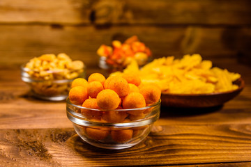 Different snacks for beer on wooden table