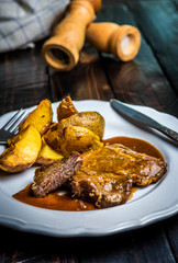 Grilled pork steak and fried potatoes