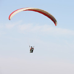 man parachute flying in the air