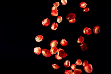 Pomegranate seed on black background