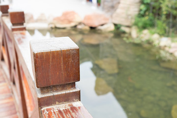 wood bridge and little pool in the park on sunshine day. for copy space background.