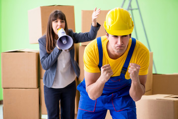 Woman boss and man contractor working with boxes delivery