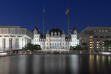 New York State Capitol and reflection at night at the Empire State Plaza in Albany, New York