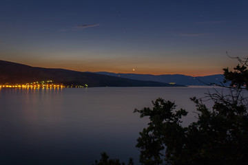 Village Baska in sunrise with sea, island Krk, Croatia