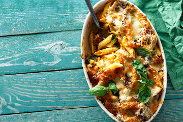 Baked pasta chicken ham parmesan pumpkin comfort food top view