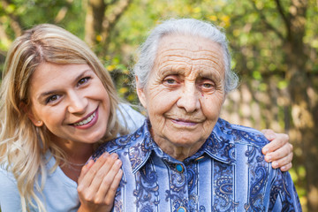 Woman embracing grandma