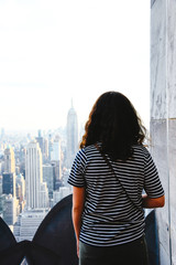 Fototapeta na wymiar A Woman looking at New York skyline