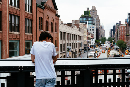 Young man looking at New York cityscape