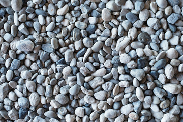 Top view of natural gravel form in dense gray tones.