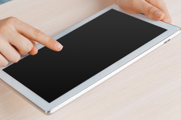 woman holding digital tablet, closeup