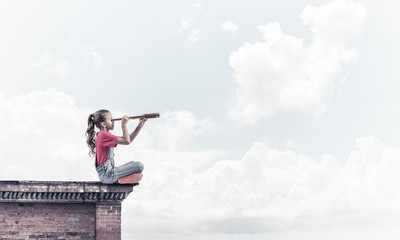 Concept of careless happy childhood with girl exploring this wor