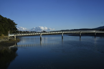 Fototapeta na wymiar Raglan Bridge over thew water