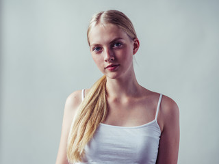 Blonde woman with long smooth hair natural portrait