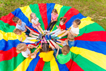 Group of kids on the lawn in the summer outdoors