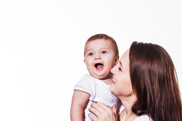 Small cute baby laughing in mother's hand