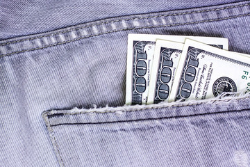 Money cash currency in jeans pocket