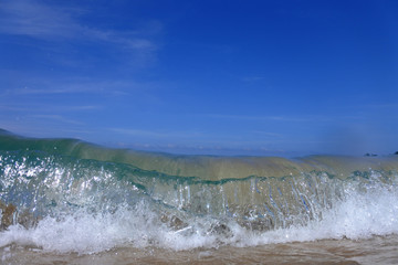 Small beach waves close up oin the Tiomen Islands, Malaysia