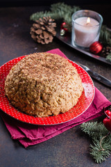 Tasty homemade Soviet traditional cake Anthill with honey on metal dark table background. Christmas Dessert with holiday decoration