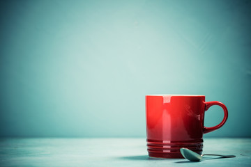 Red cup on blue background