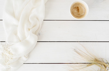 Feminine white desk table with coffee cup, wheat ear. Top view with copy space. Flat lay. Top view. Copy space for lettering, text, blogs, magazines, headers, freelanse