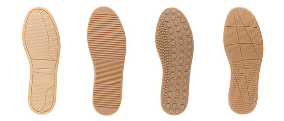 Four shoe sole in row. White background.
