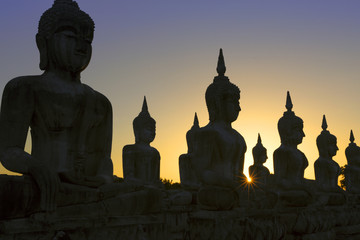 Buddha statues in sunset