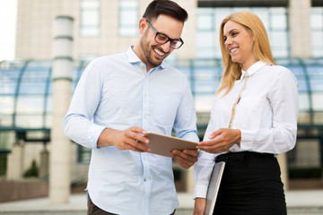 Happy business colleagues in modern office