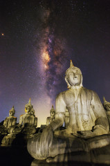 The Buddha statues with milky way at night.