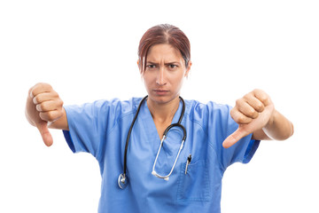 Angry unhappy woman nurse or doctor making thumbs down gesture.