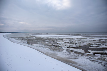 frozen lake shore in winter
