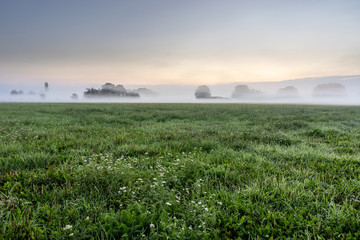 Fototapeta na wymiar Foggy morning in the haze landscape.